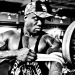 An athlete bandages his hand with an elastic bandage