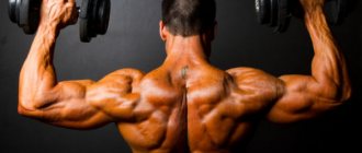 Pumped up athlete with dumbbells