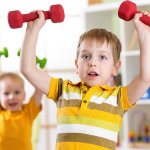 Child with dumbbells